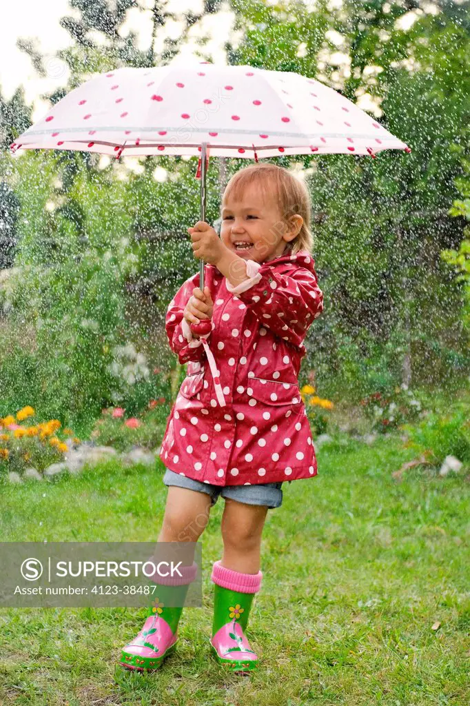 Little girl with umbrella.