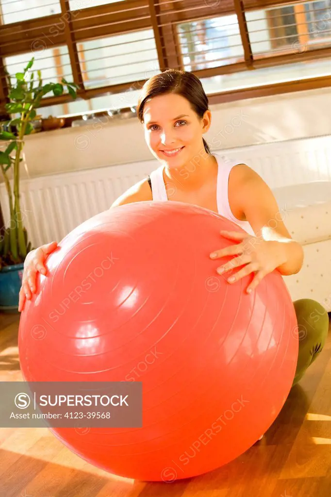 Woman doing exercises with a ball.