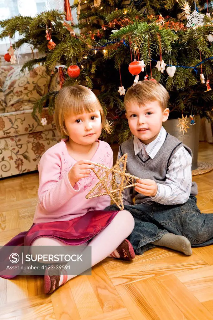 Children celebrating Christmas at home.