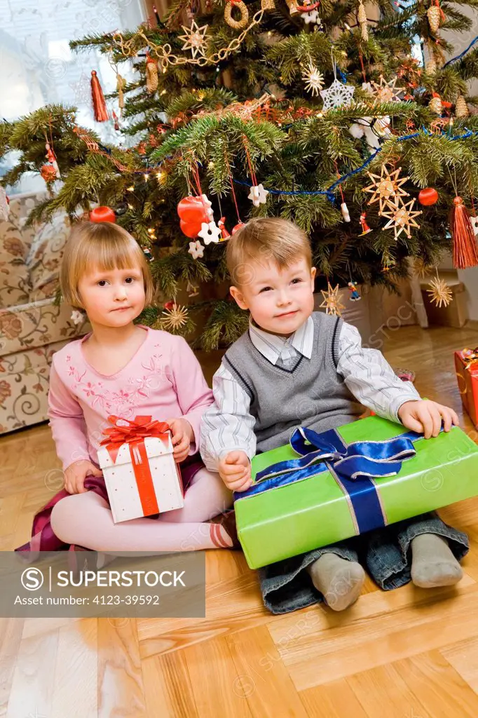 Children with Christmas presents.
