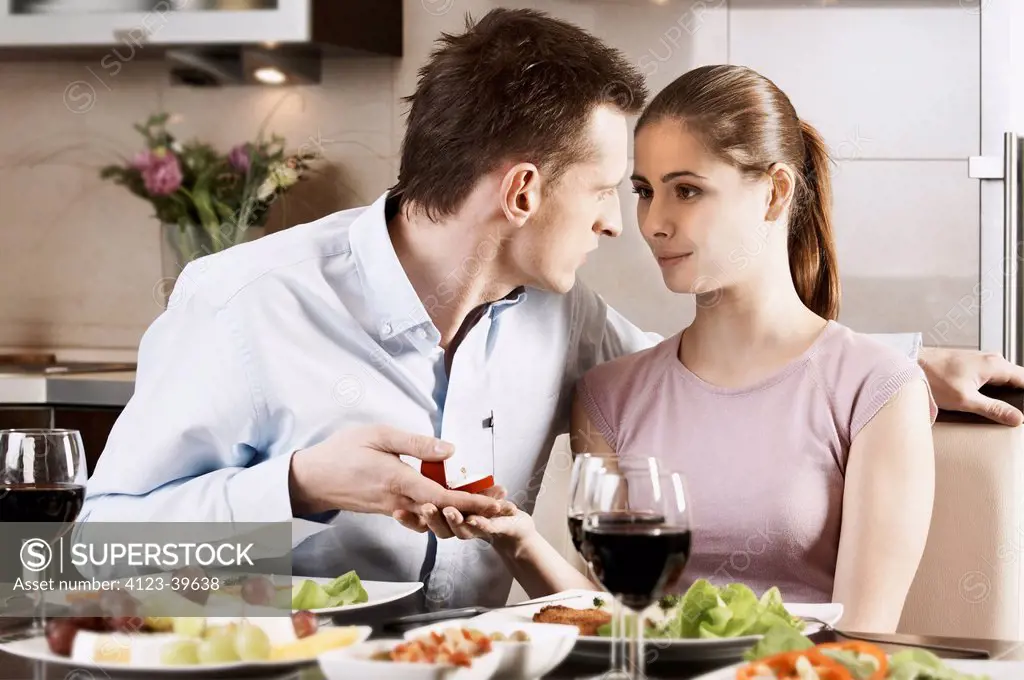 Young couple while eating dinner