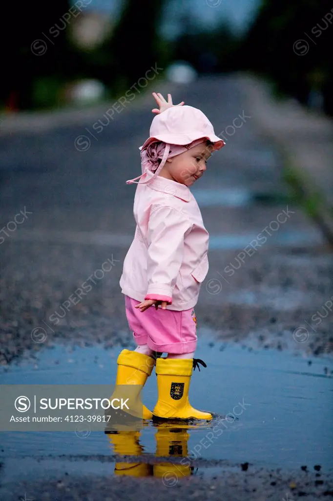 Child playing after rain.
