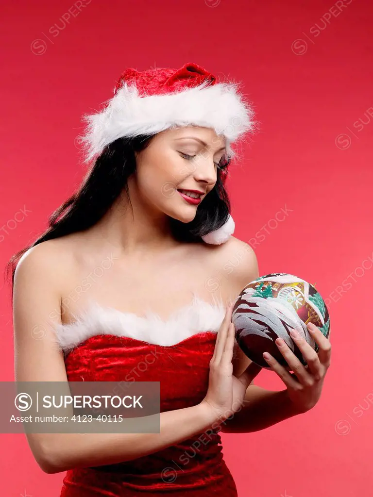 Woman holding Christmas glassball.
