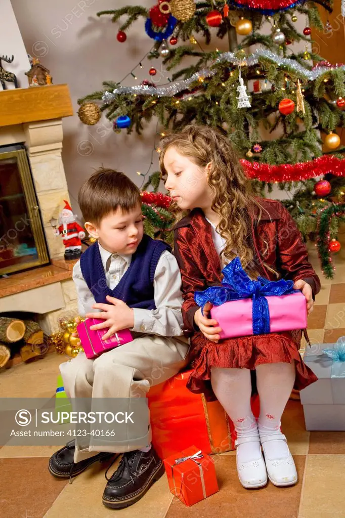 Children waiting for opening presents.