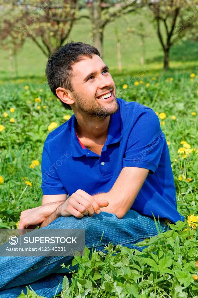 Man sitting in the grass.