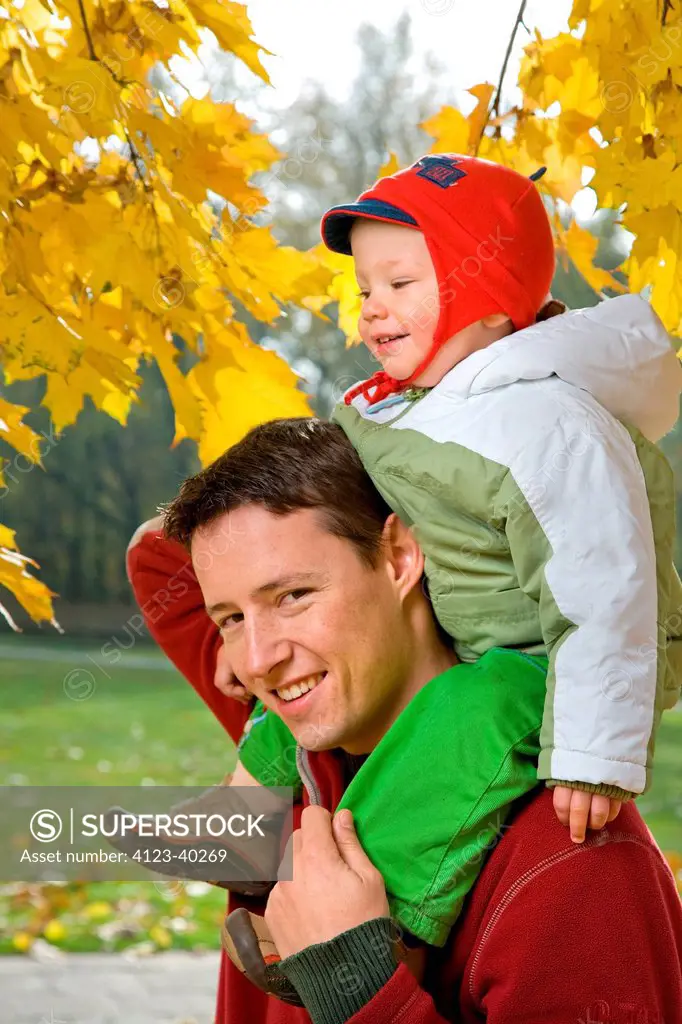 Man and his son spending time together in park.