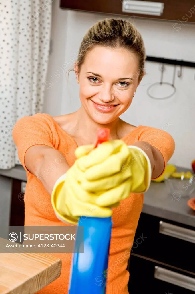 Young woman cleaning up.