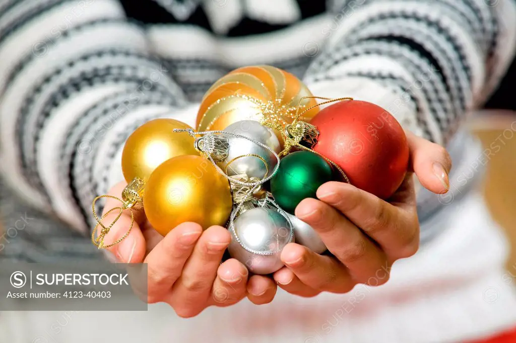 Woman holding baubles.