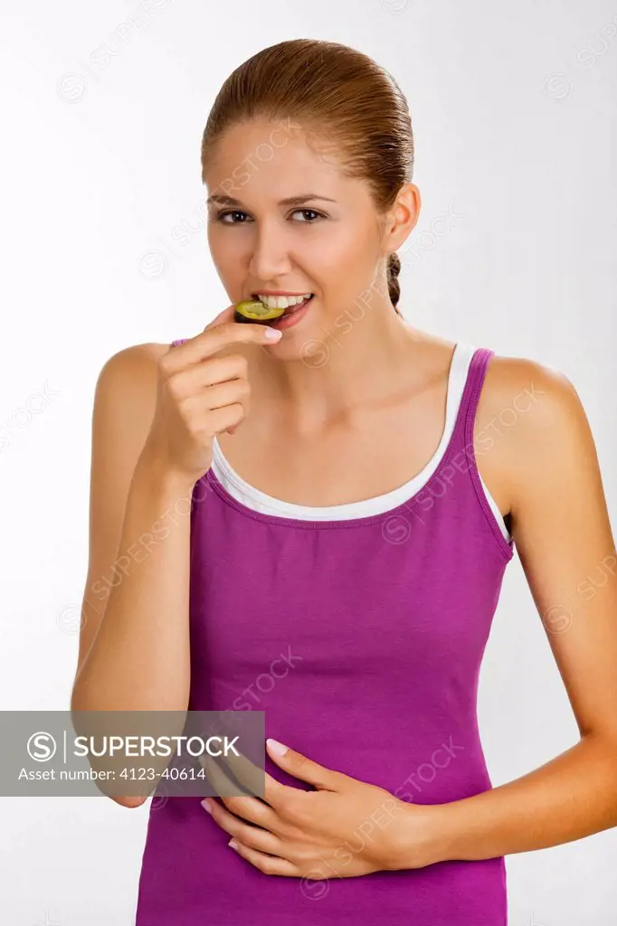 Woman eating plum.