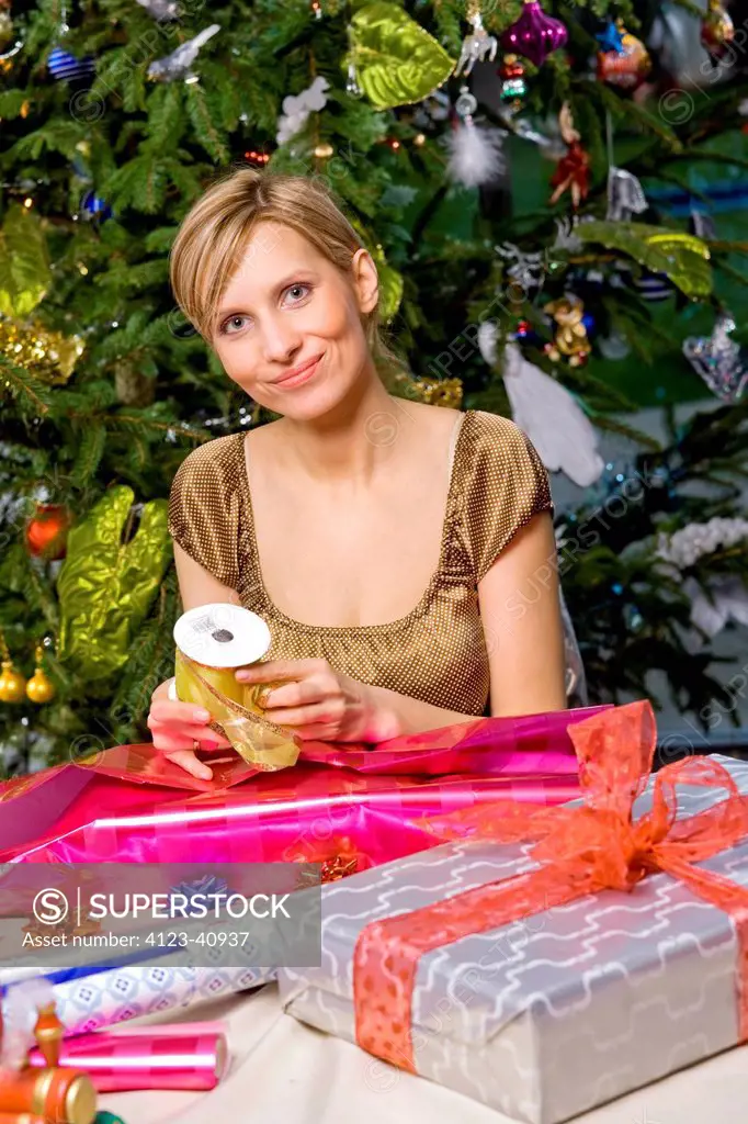 Woman packing Christmas presents.