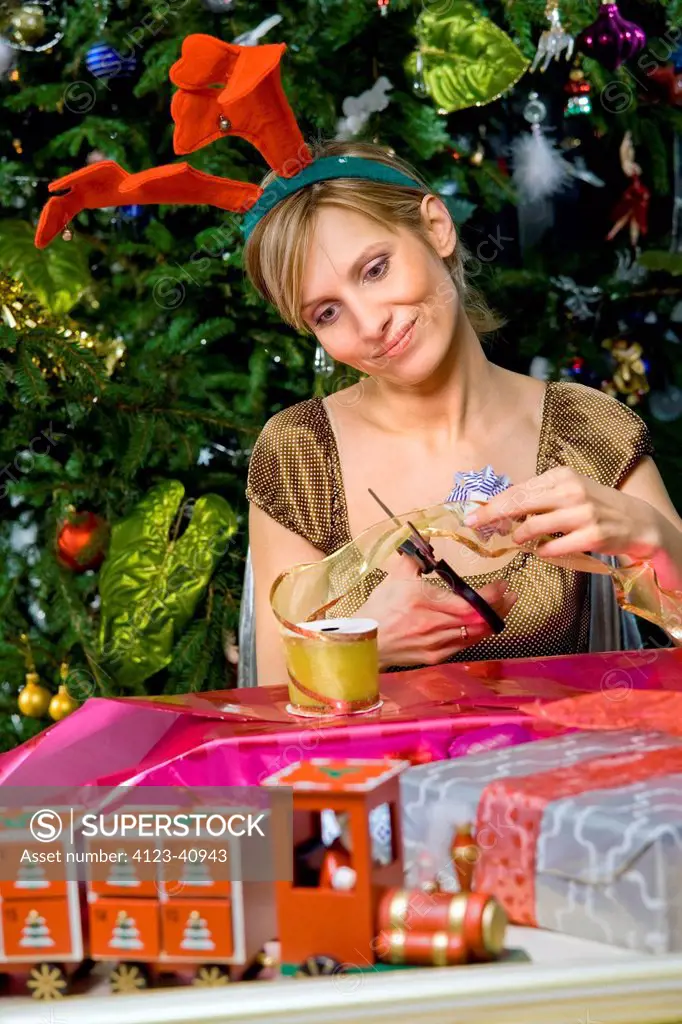 Woman packing Christmas presents.