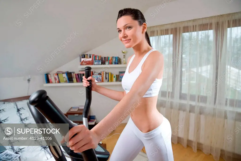 Woman doing exercises on stepper.
