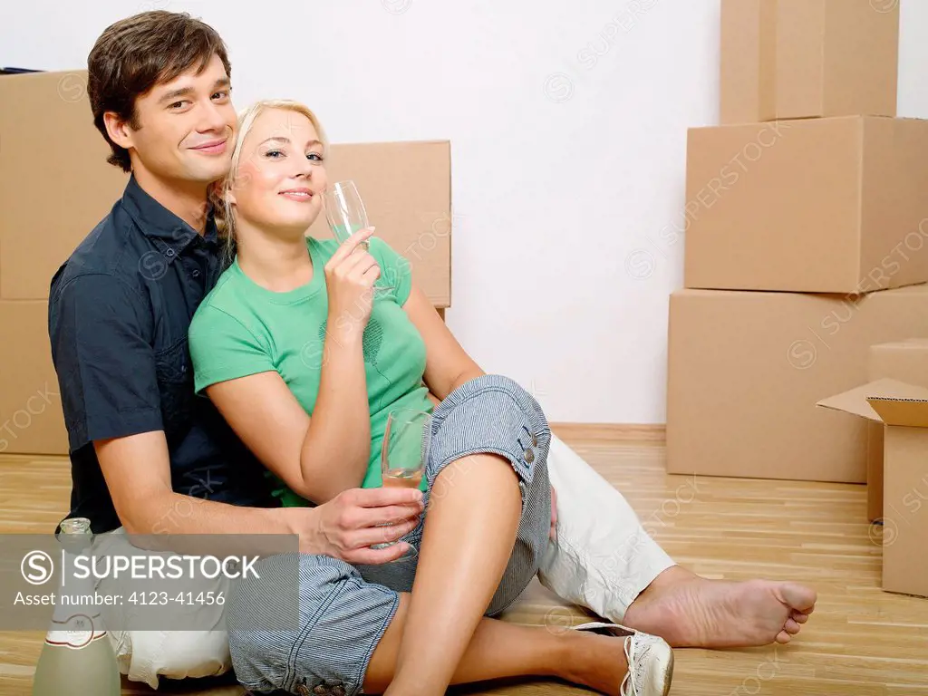 Young couple moving in new flat