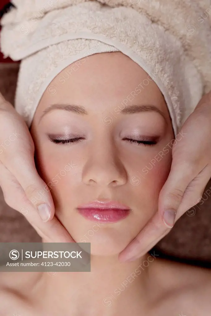 Woman having face massage.