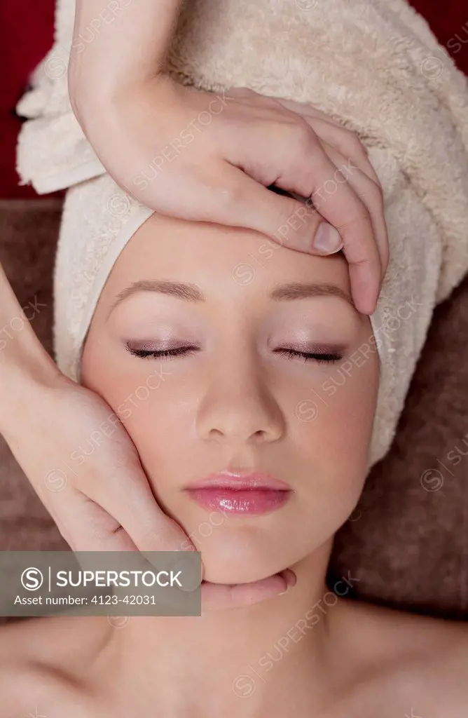 Woman having face massage.