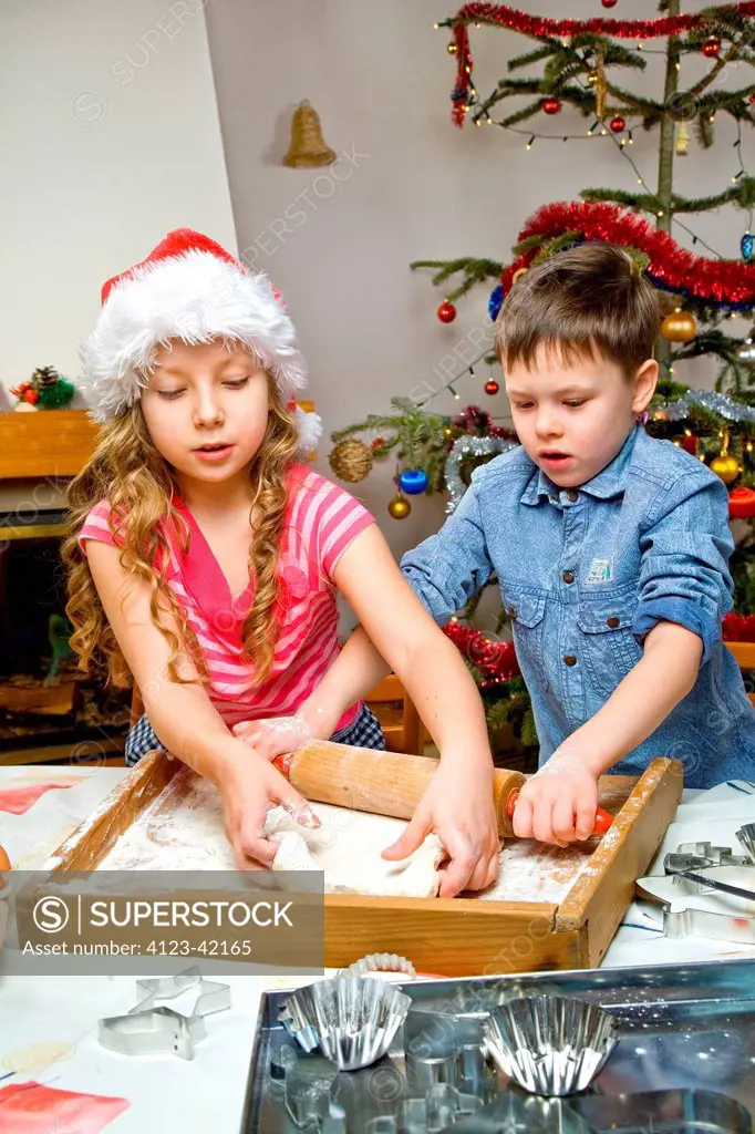 Children making Christmas cake.