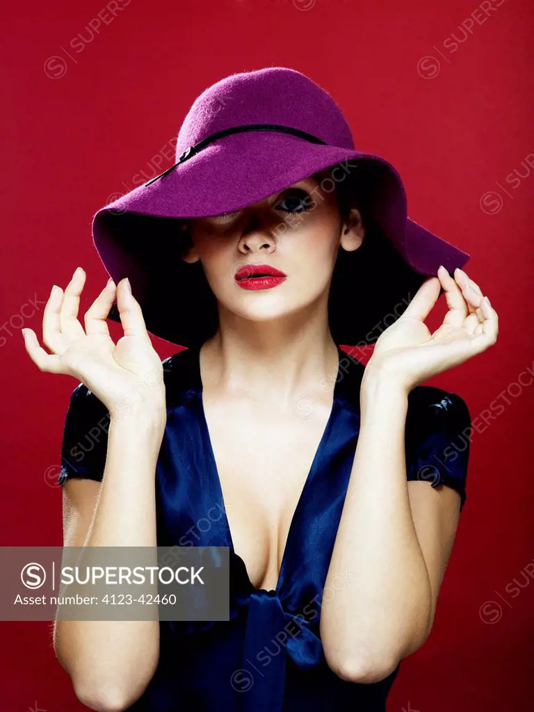 Young woman wearing a violet hat.
