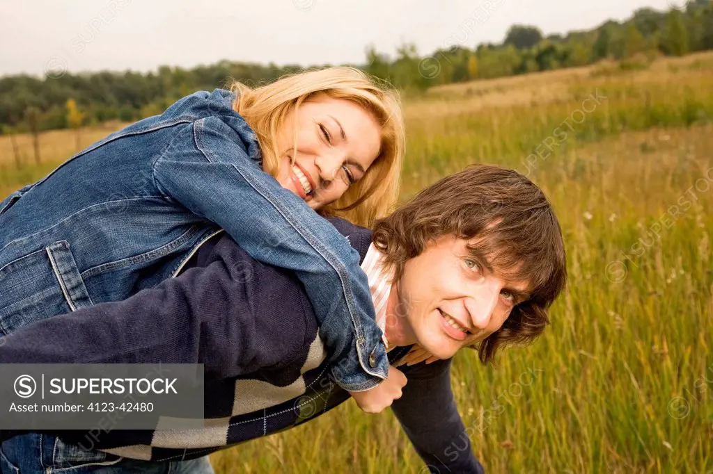 Couple spending free time on the meadow.