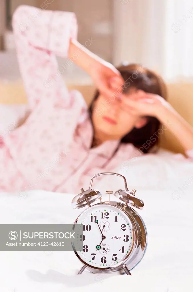 Young woman waking up.