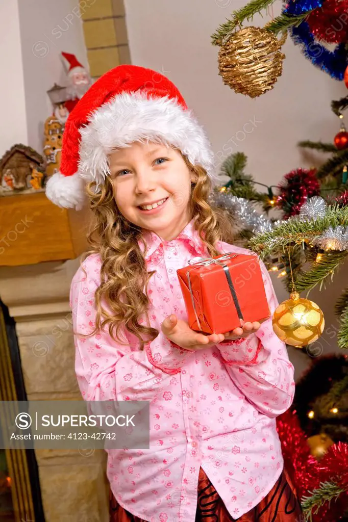 Girl holding present.