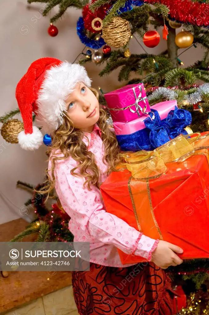 Girl holding presents.