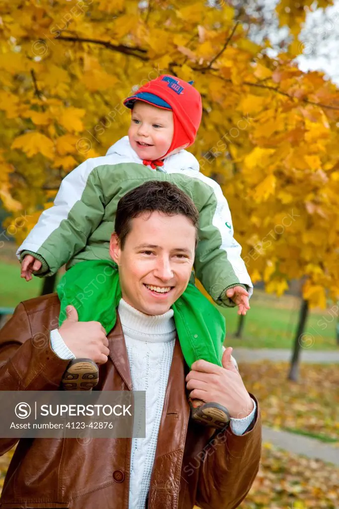 Man and his son spending time int the park.