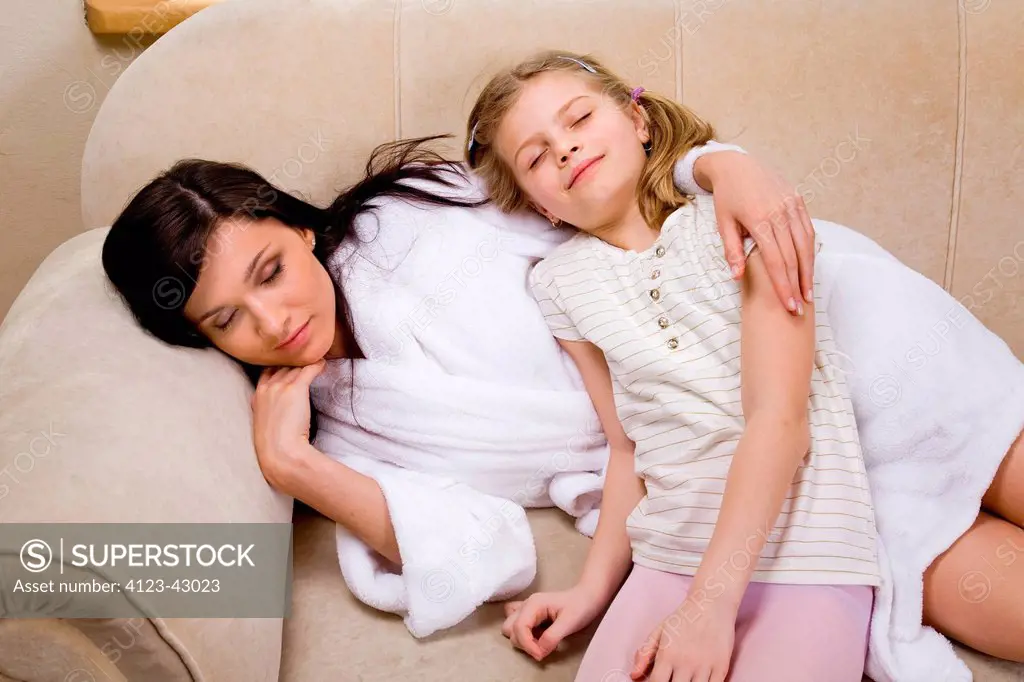 Woman and girl sleeping.