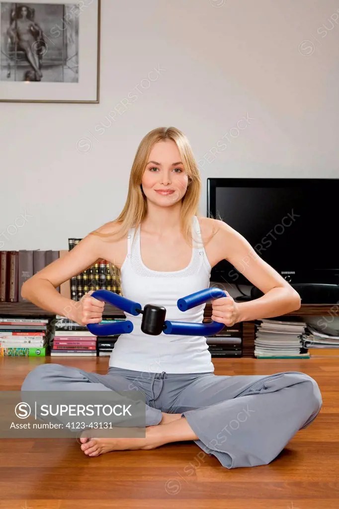 Young woman exercising in the living room