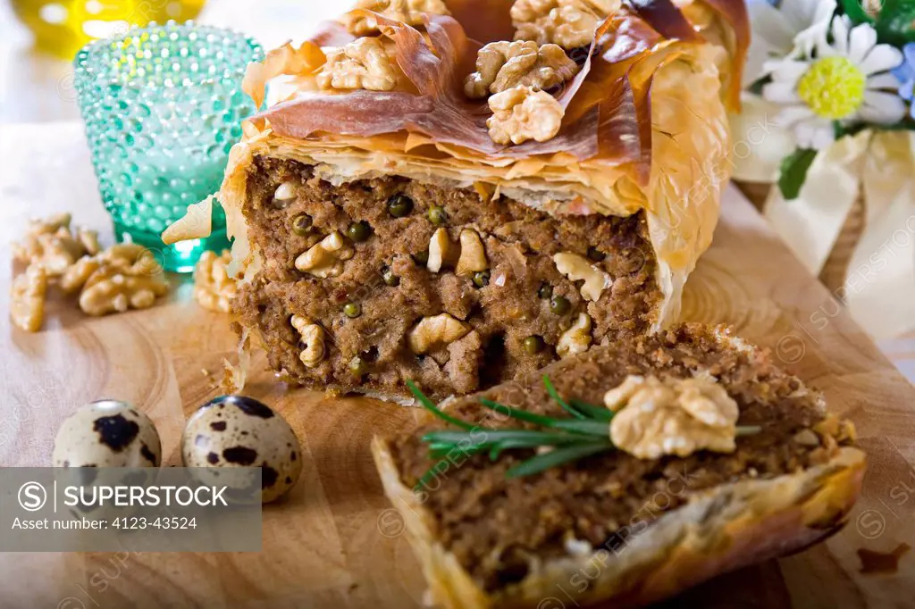 Pate with walnuts and capers baked in pastry crust.