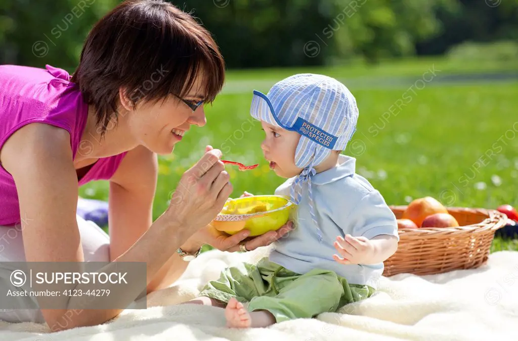 Mother spending time with her child in the garden.