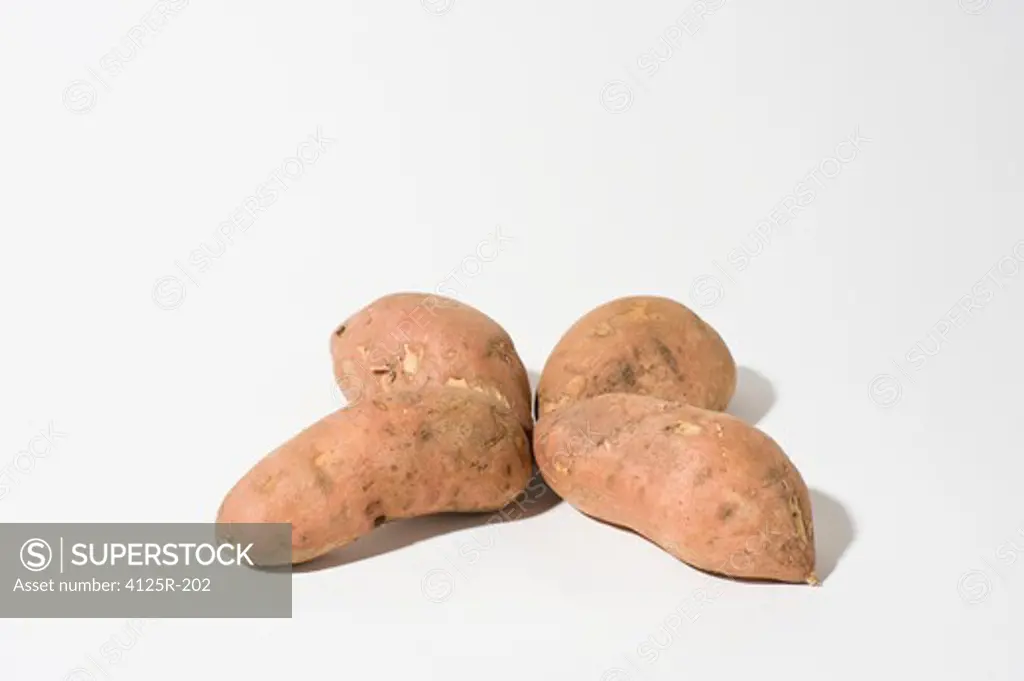 Organic Sweet Potato Yams in clover shape on white background