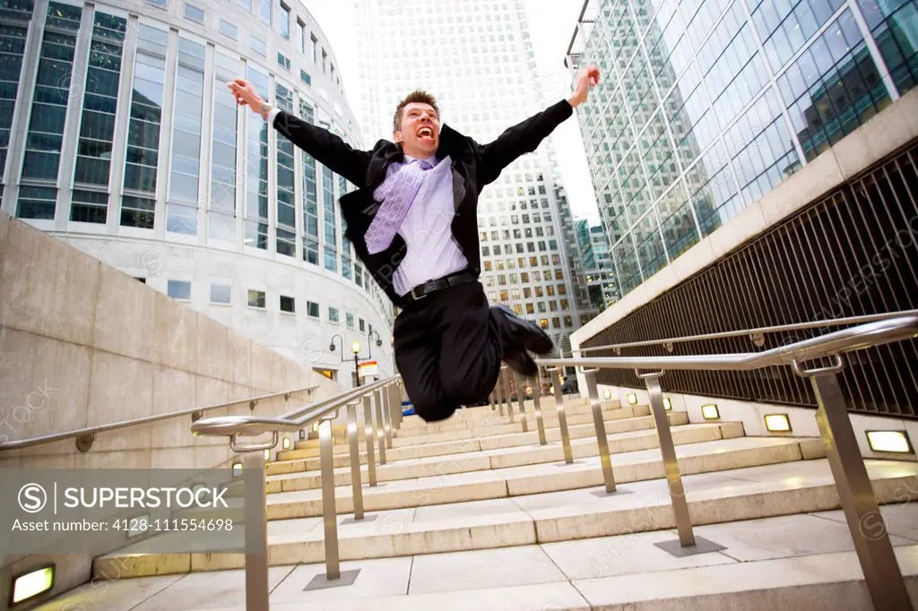 Businessman jumping for joy