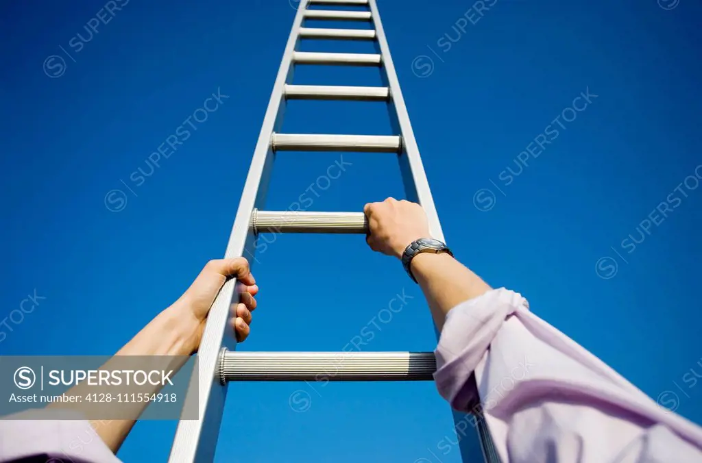 Businessman climbing a ladder