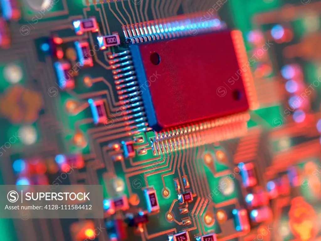 Electronic circuit board containing chips and components.