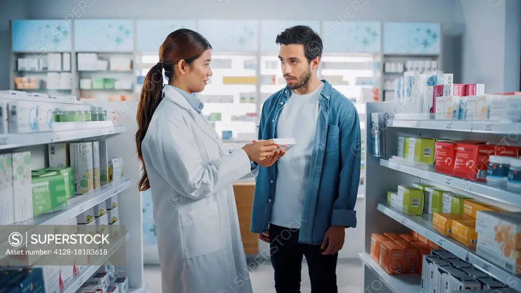 Pharmacist advising a customer on medication