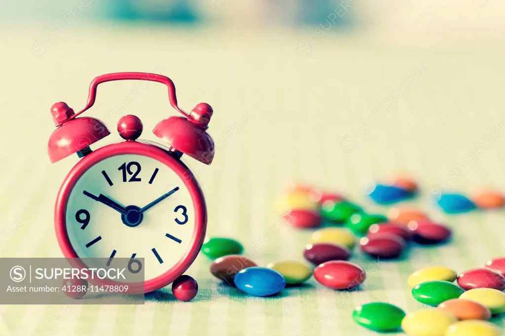 Alarm clock and confectionary.