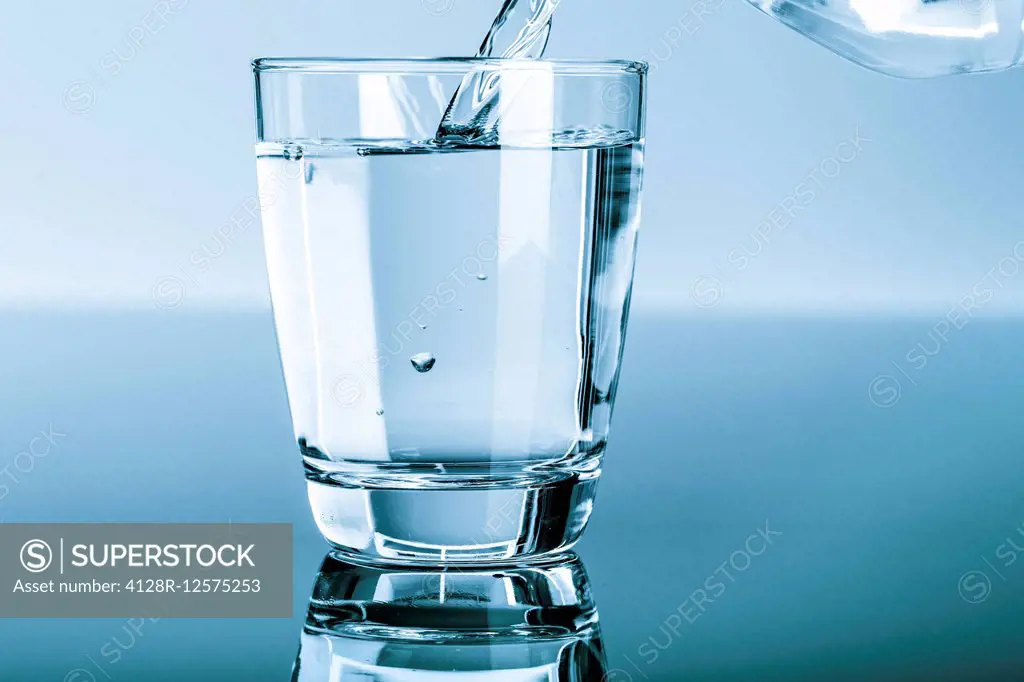 Water being poured into a glass.