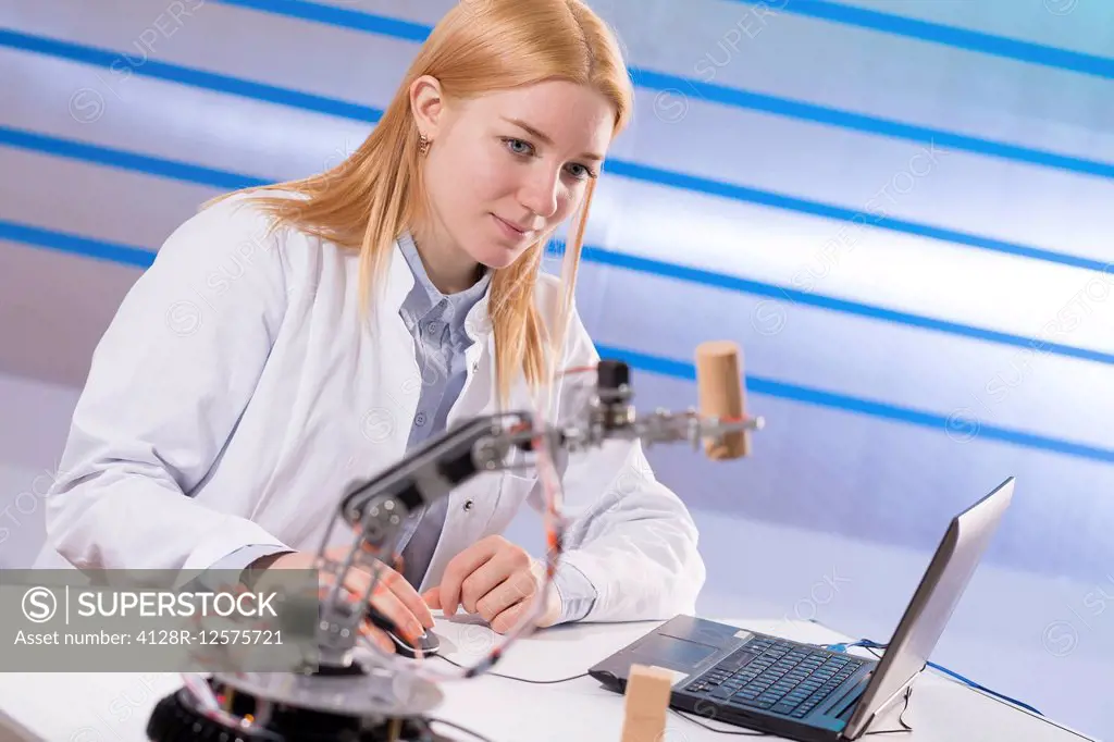 Female student working in a robotics laboratory.