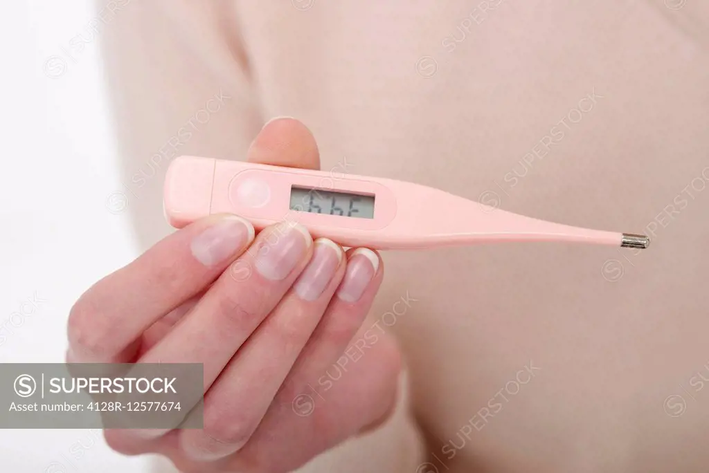 Woman reading her temperature.