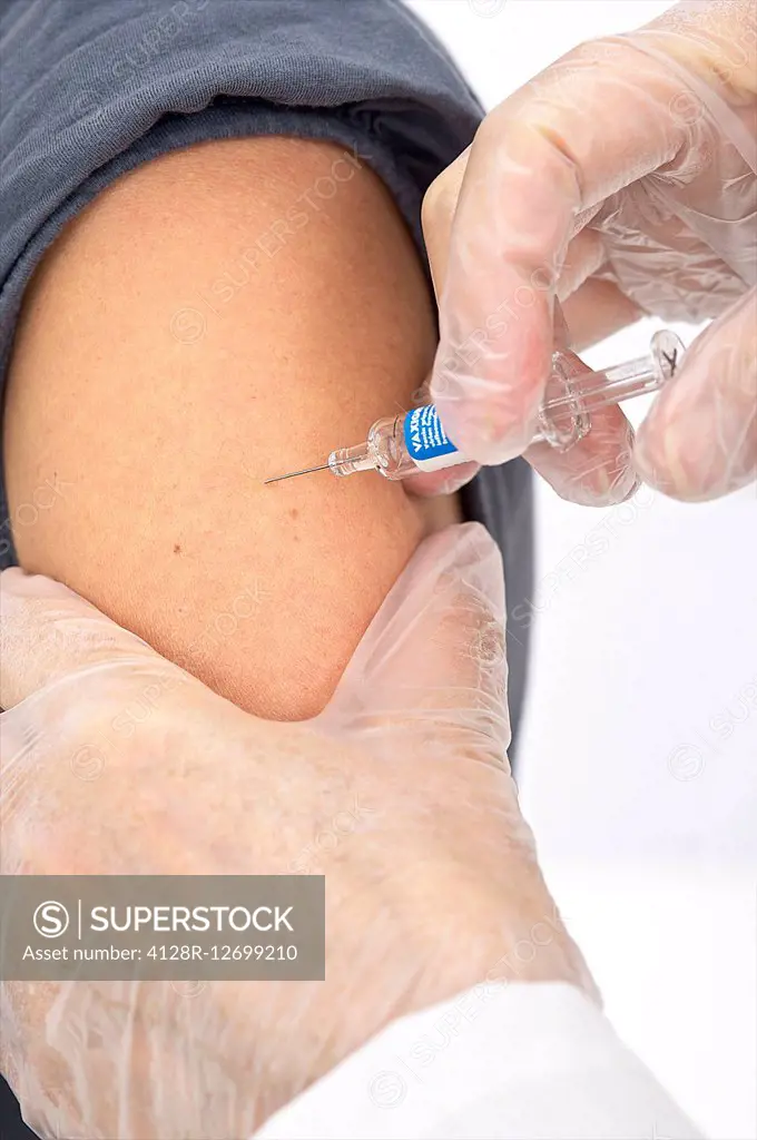 Woman receiving a vaccination.