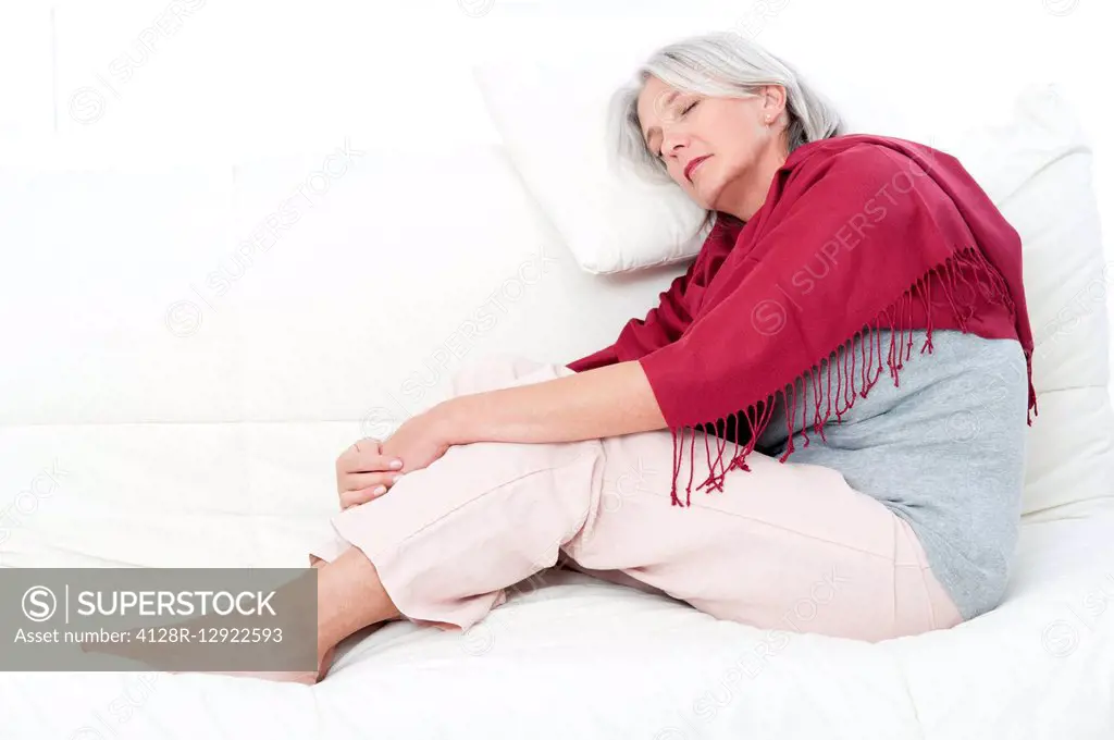Woman lying on bed asleep