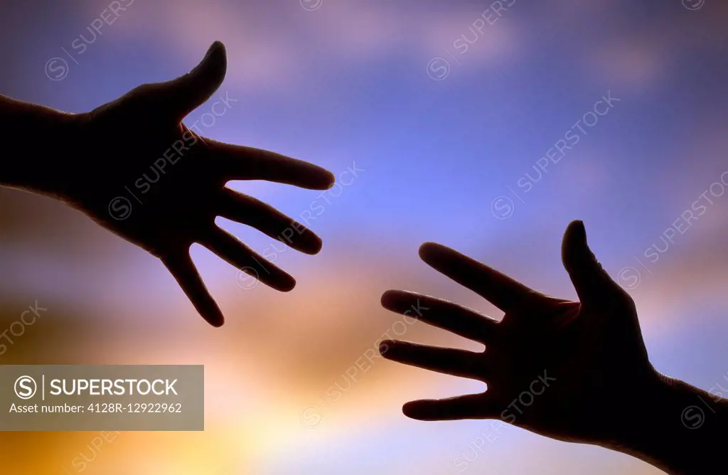 Hands reaching towards each other
