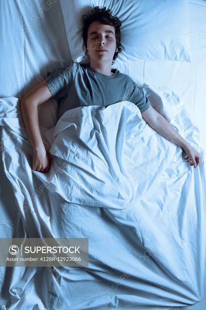 Man asleep in a bed