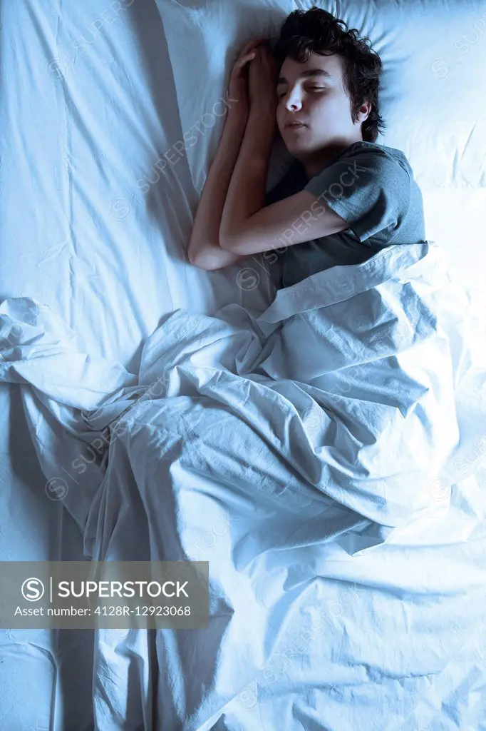 Man asleep in a bed