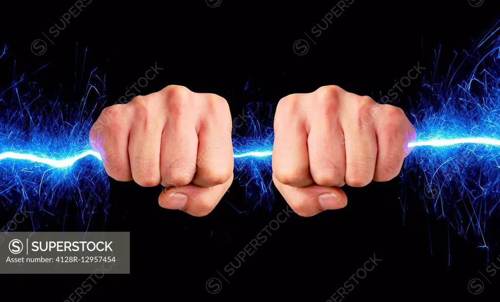 Hand holding blue sparks