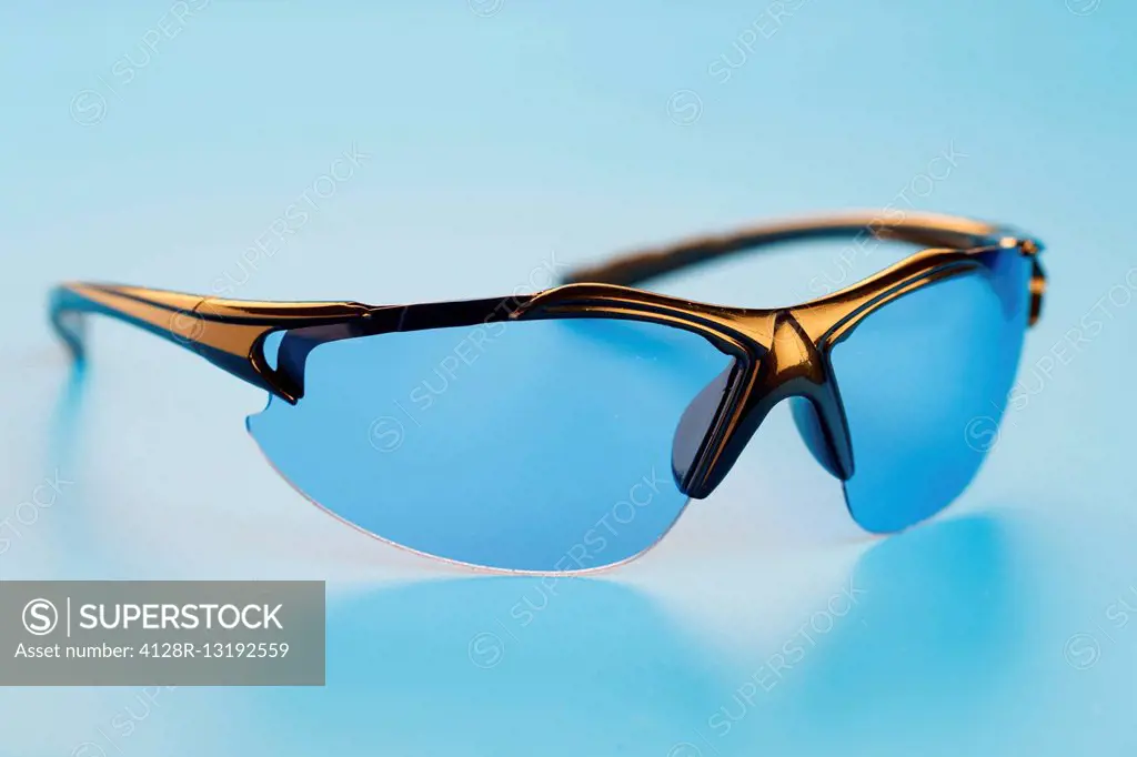 Eyeglasses against a blue background.