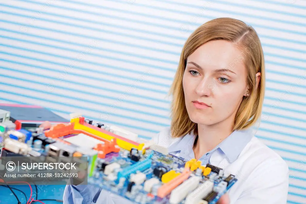 Female electrical engineer working in the laboratory.