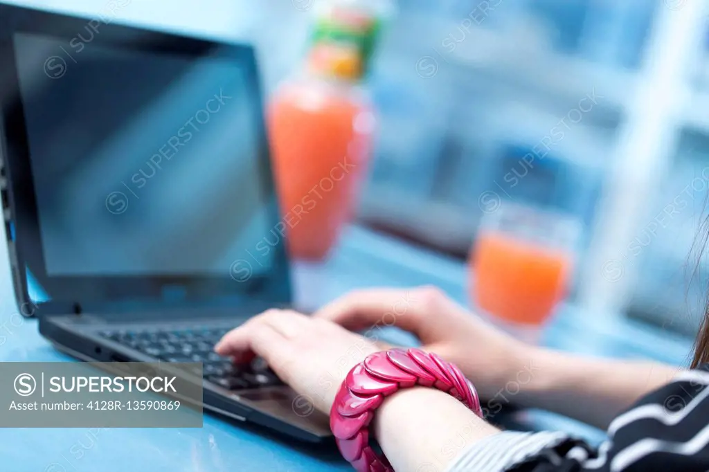 Woman using laptop.