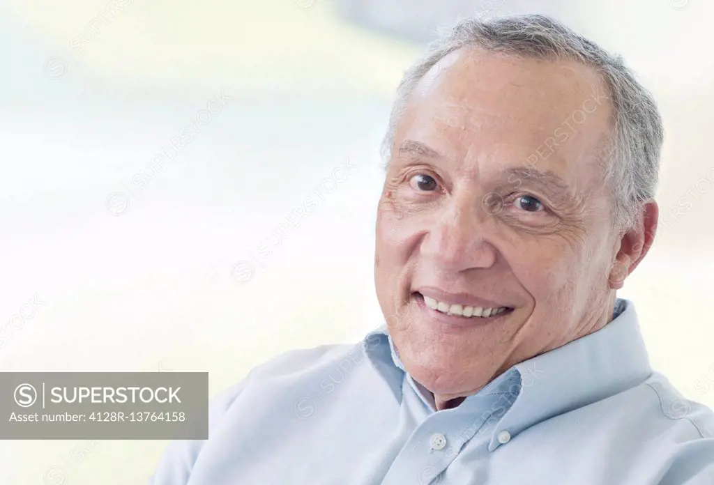 Senior man smiling towards camera.