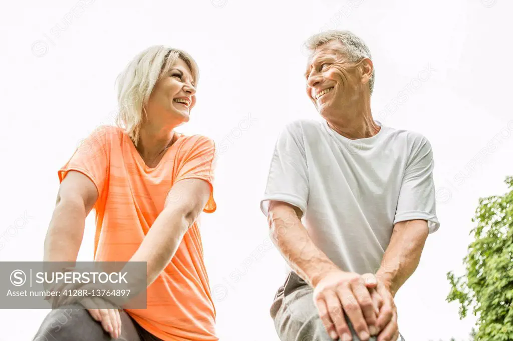 MODEL RELEASED. Couple smiling, low angle view.